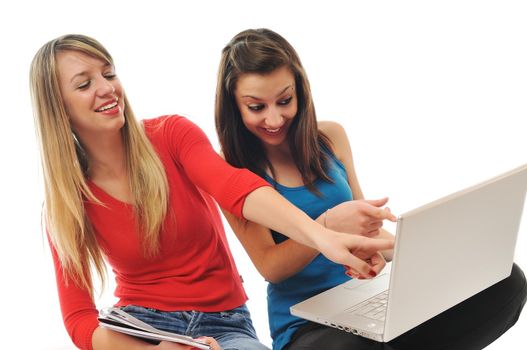 two girl work on laptop