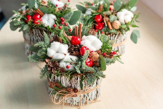Christmas decoration with carnations, chrysanthemums santini, brunia and fir.