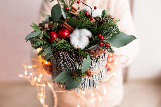 Christmas decoration with carnations, chrysanthemums santini, brunia and fir.