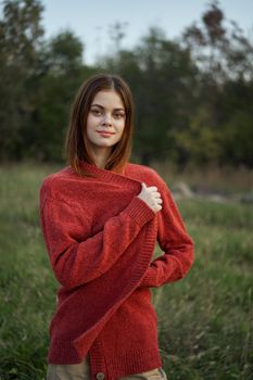 woman red sweater cool air nature romance