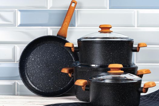 Close up photo of cookware set on kitchen counter