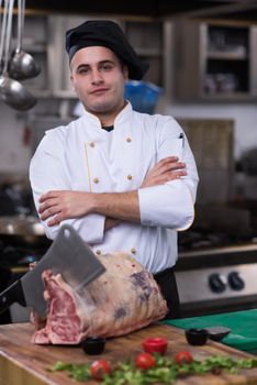 chef cutting big piece of beef