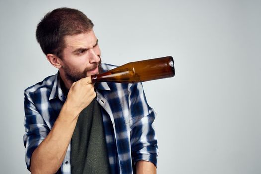 a man in a plaid shirt drinking beer alcohol emotion isolated background