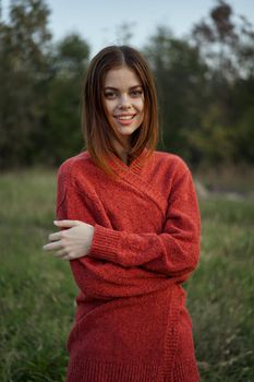 woman red sweater cool air nature romance. High quality photo