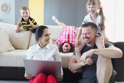 Happy smiling family spend time together in living room