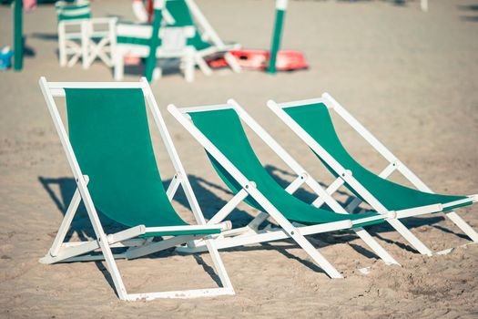 Beach chairs on european beach in italy in popular area