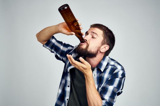 drunk man drinking beer alcohol emotion light background