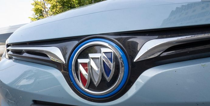 Logo of Electric vehicle Buick VeLite 6 on streets of Kyiv, near EV charging station. General Motors family next generation electric car based on Chevrolet Bolt technology . 17th of june 2021 Kyiv, Ukraine,