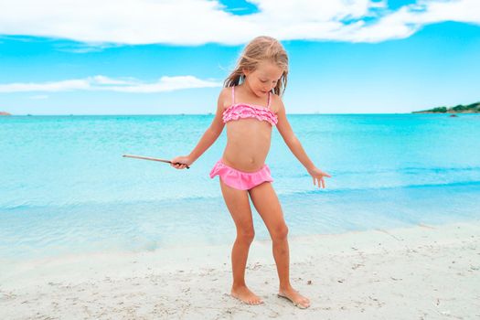 Cute little girl at beach during summer vacation