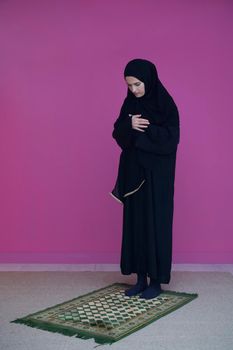 Muslim woman in namaz praying to Allah