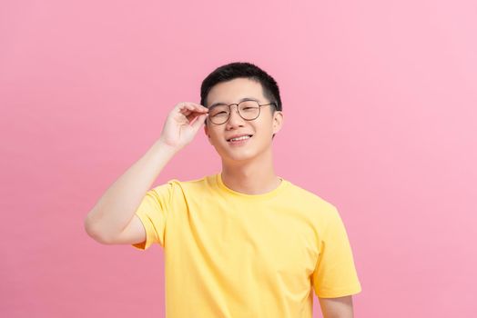 Portrait of a handsome man holding eyeglasses