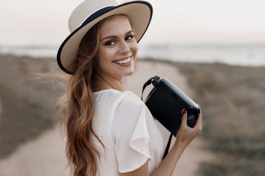 happy young woman with camera outdoor