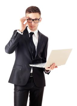 Business man holding a laptop and looking surprised.