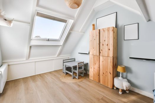 Attic room with wooden floor and skylight