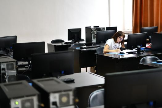 one student in computers classroom