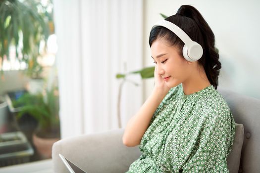 Woman listen to music on tablet pc