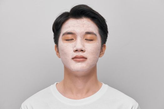 men skin care mask on white background