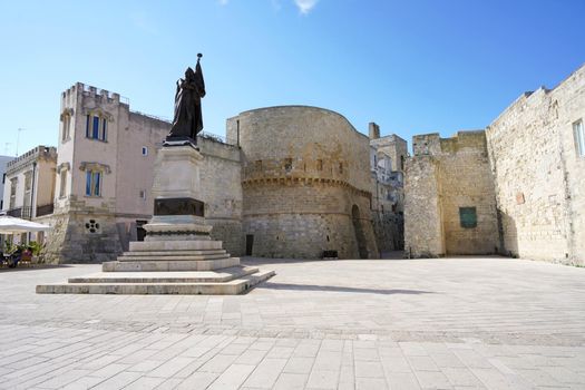 Lungomare degli Eroi with monument on promenade with Torre Alfonsina tower in Otranto, Italy
