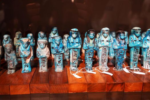 TURIN, ITALY - AUGUST 19, 2021: blue small votive statuettes during the Egyptian civilization, Egyptian Museum of Turin, Italy