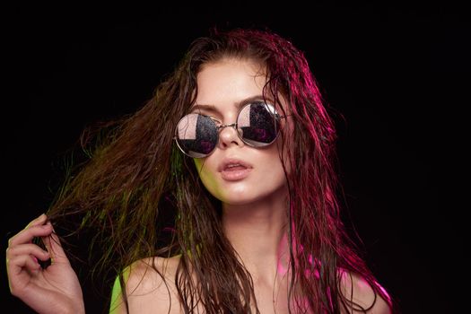 portrait of a woman attractive glance posing sunglasses studio lifestyle