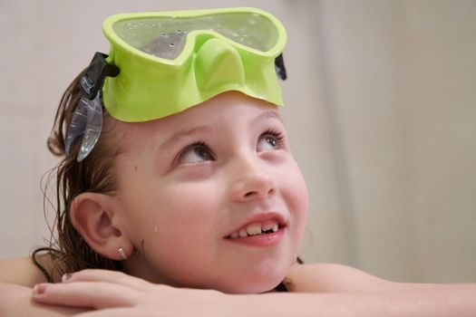 little girl with snorkel goggles