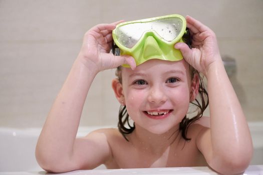 little girl with snorkel goggles