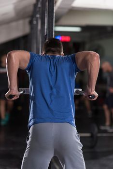 man doing exercises parallel bars