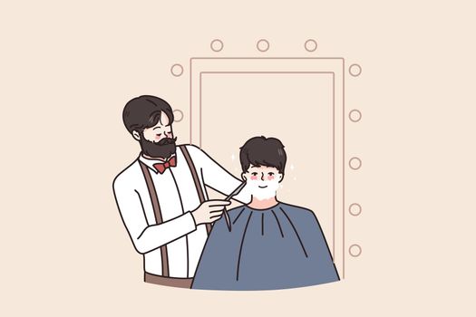 Man get beard shaved in barber saloon