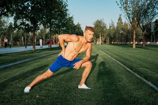 athletic man workout in the park fitness cardio