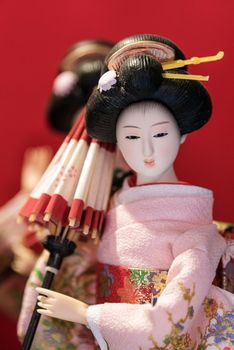 Cute Japanese traditional doll in kimono costume the famous souvenir from Japan