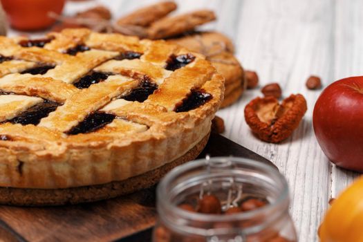 Berry tart pie on white wooden table