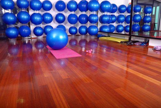 fitness studio with blue pilates balls