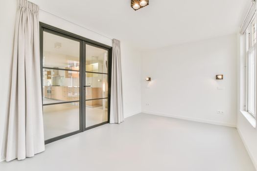 Large white room with sliding glass doors