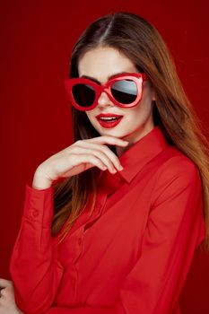 cheerful woman in a red shirt sunglasses Glamor close-up