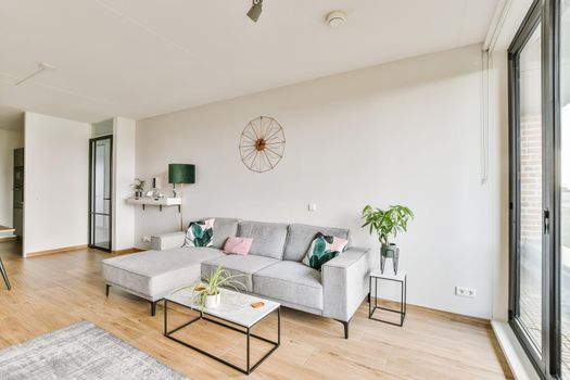 Stunning living area with gray plush sofa
