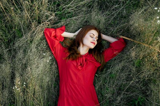 woman in red dress nature green grass landscape rest