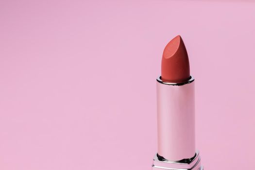Lip make up product on pink background