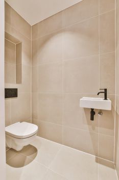 Stylish washroom in minimalist style with hanging toilet