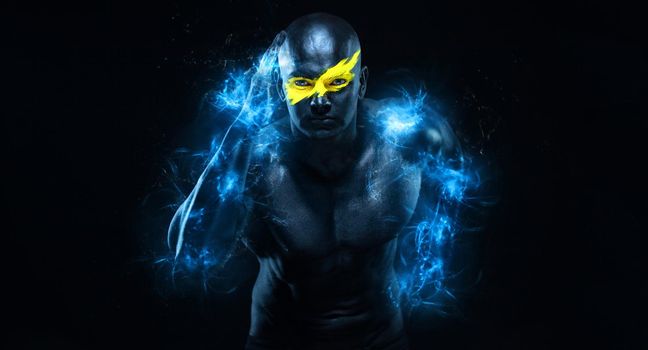 Sprinter and runner man. Running concept. Fitness and sport motivation. Strong and fit athletic, guy in body paint like a super hero in flashes. Sprinter or runner, running on black background.