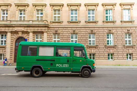 Old German police minibus with transparent glasses. Berlin, Germany - 05.17.2019