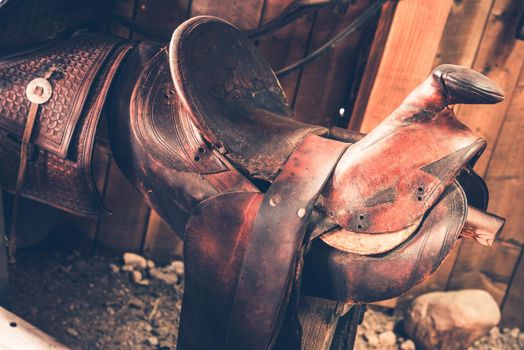 Brown Leather Saddle Closeup. Aged Western Style Saddle.