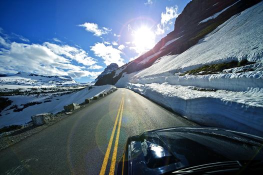 Ridge Road Drive - Road-To-The-Sun in the Glacier National Park in Montana, U.S.A. Snowfields and Rocks. Montana Landscape.