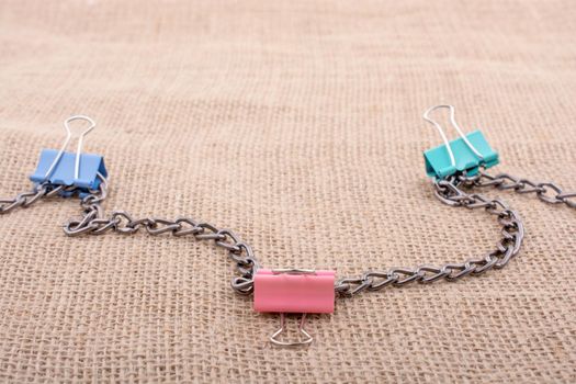 Colorful clips placed on  linen canvas