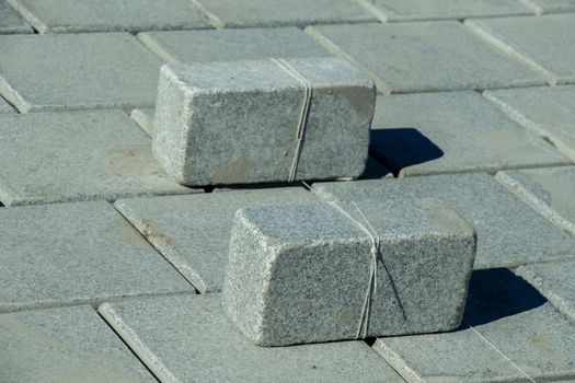Concrete pavement stones as building material
