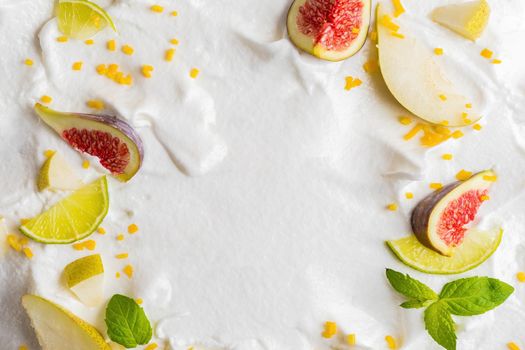 Whipped cream from egg whites with berries of figs, pears, lemon.