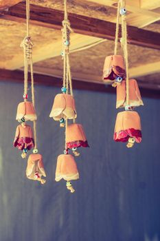 A bunch of colorful miniature bells hanging