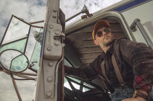 Professional Trucker Driver in Semi Truck Cabin