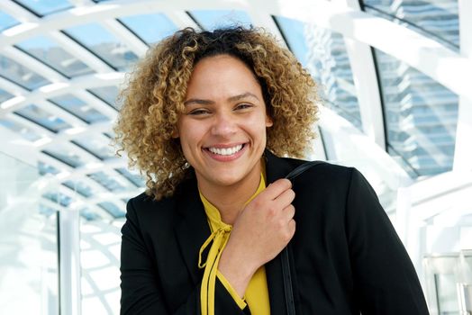 horizontal portrait of business woman with curly hair laughing