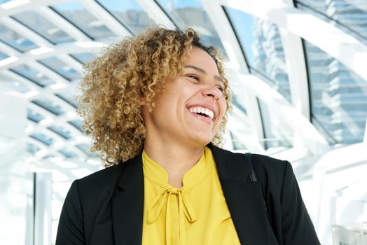 horizontal portrait of business woman laughing and looking away