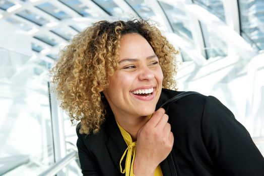 horizontal portrait of businesswoman laughing and looking away
